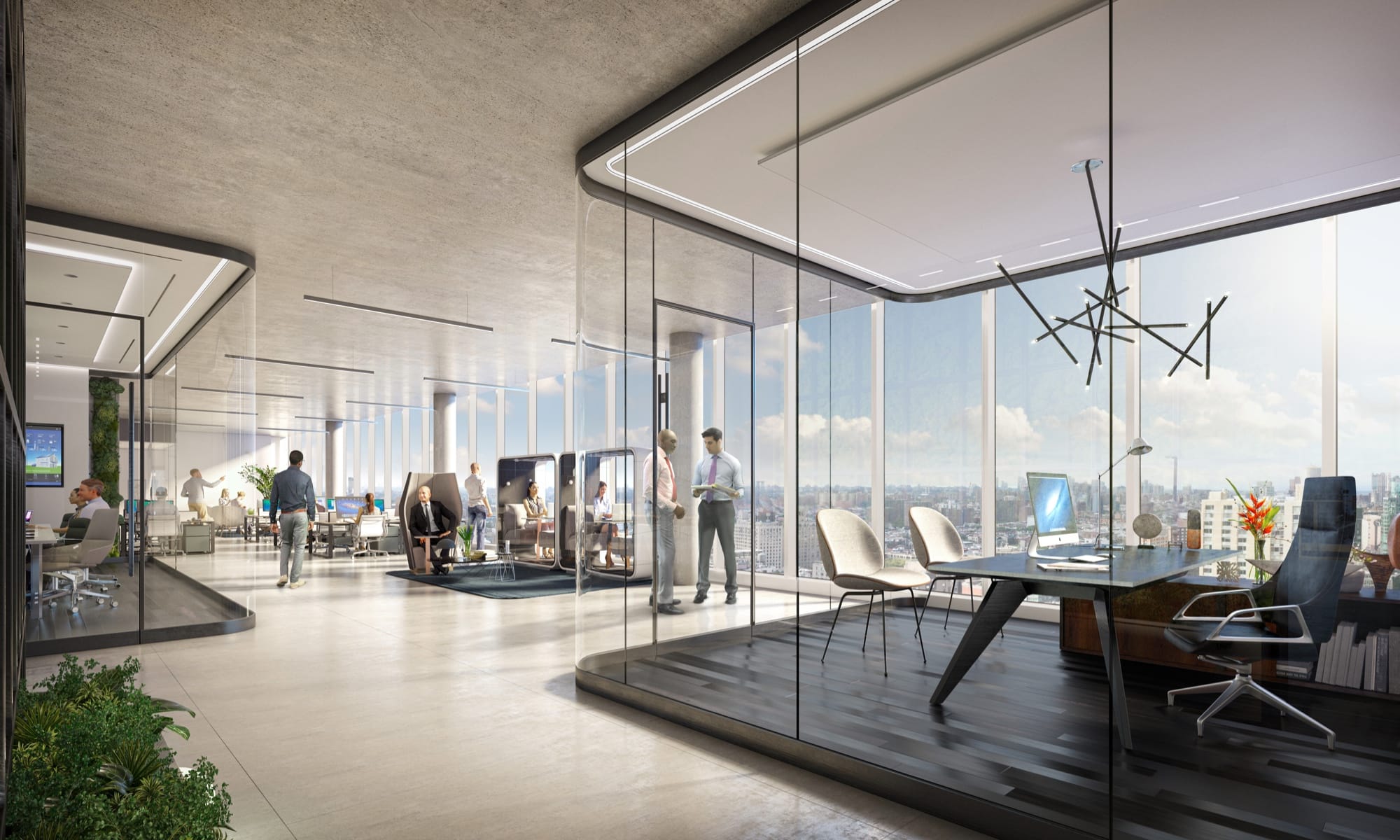 Open concept workspace with glass-walled offices